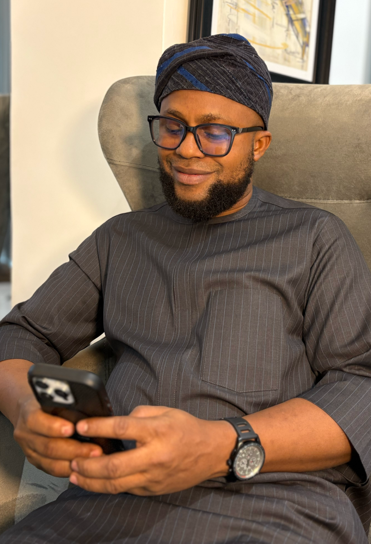 man-with-beard-looking-at-his-phone
